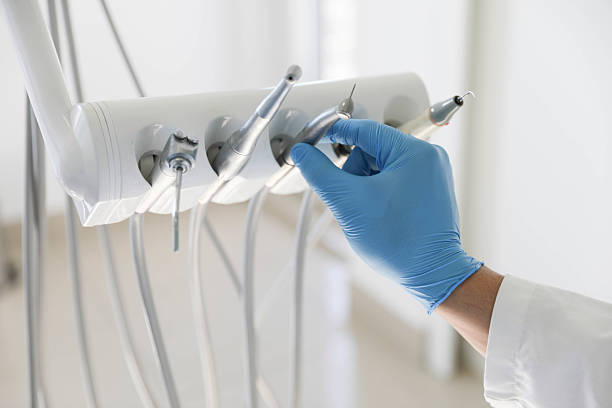 Professional Tooth Extraction technician working in Ludington, MI